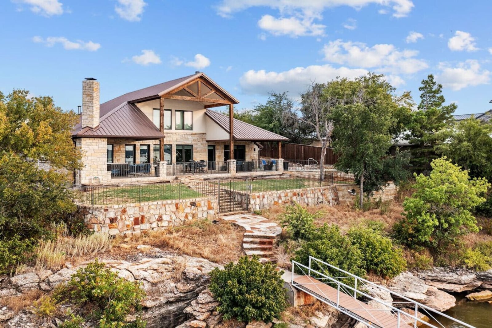 PK Lake House stone exterior overlooking Possum Kingdom Lake in Graford, Texas